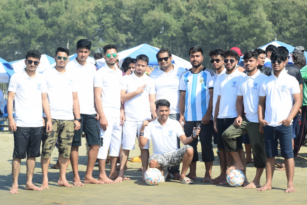 a group of men posing for a photo