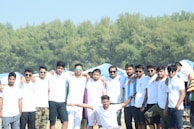 A group of friends wearing matching custom t-shirts at a picnic.