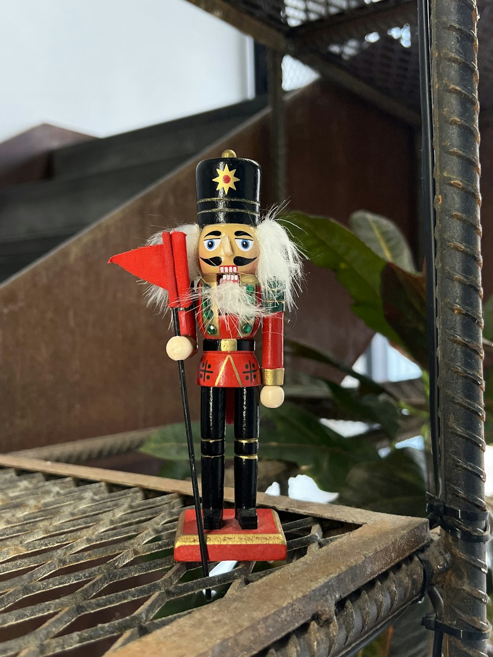 a small figurine on a wood surface