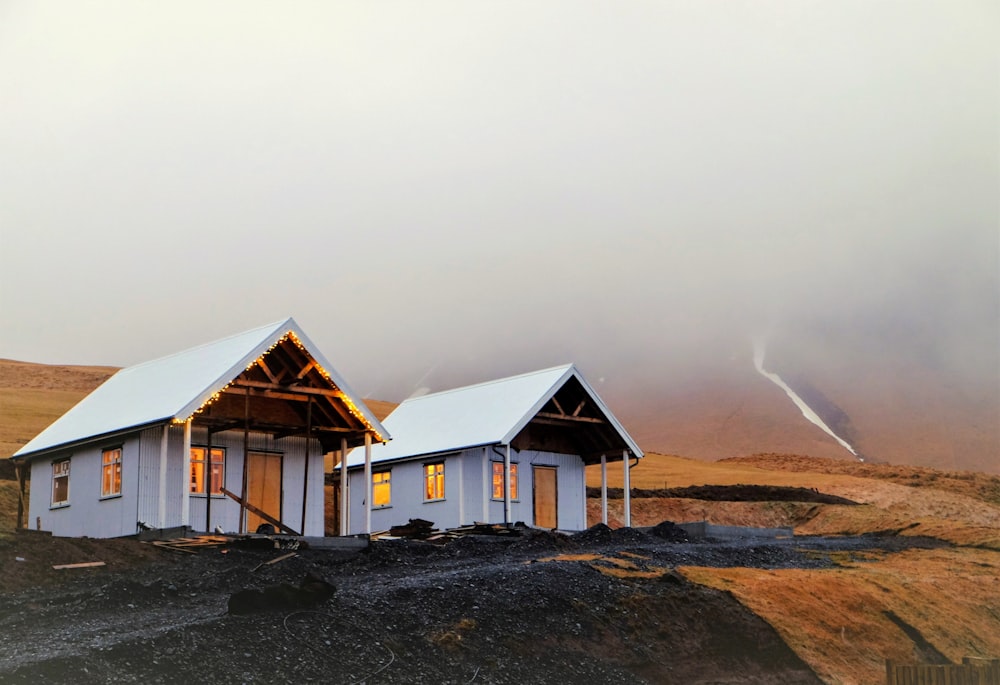 a couple of houses on a beach