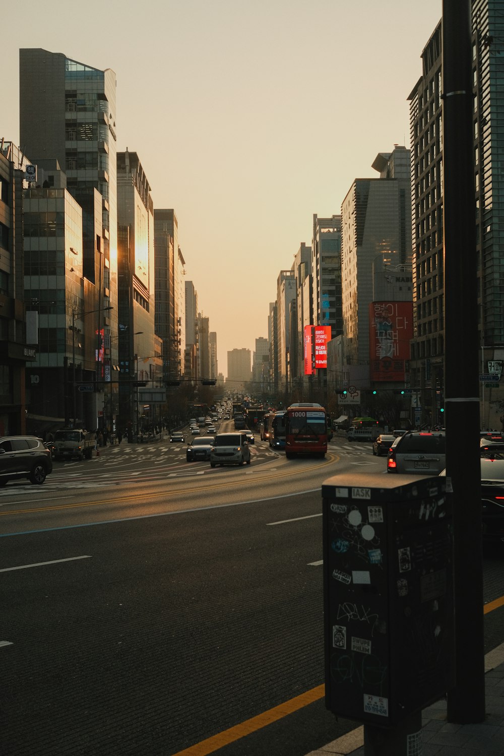 a city street with cars and buildings