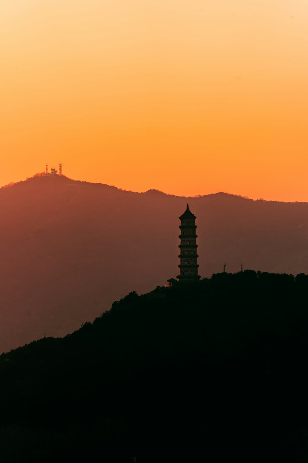 a tall building on a hill