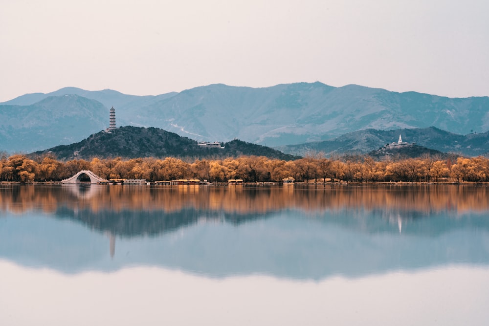 a body of water with a land in the back