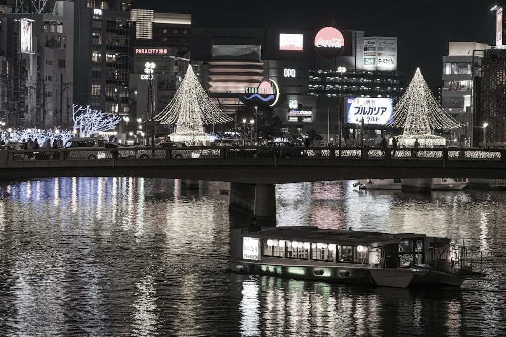 a boat in a river with buildings in the background