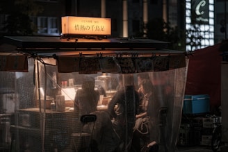A warm, rustic polathu roof stall with Hopper Daddy preparing fresh loaded hoppers under soft glowing oil lamps.