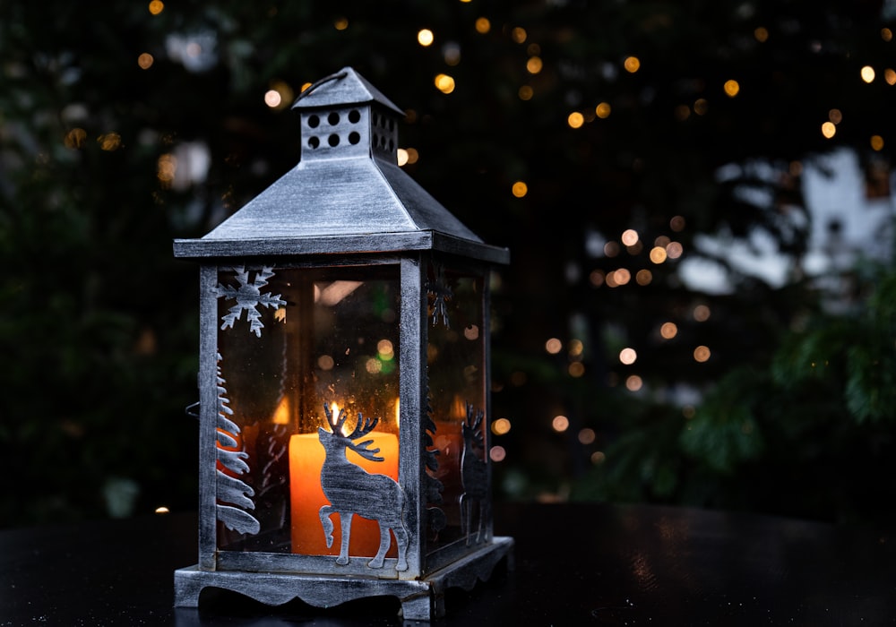 a small lantern with a fire inside