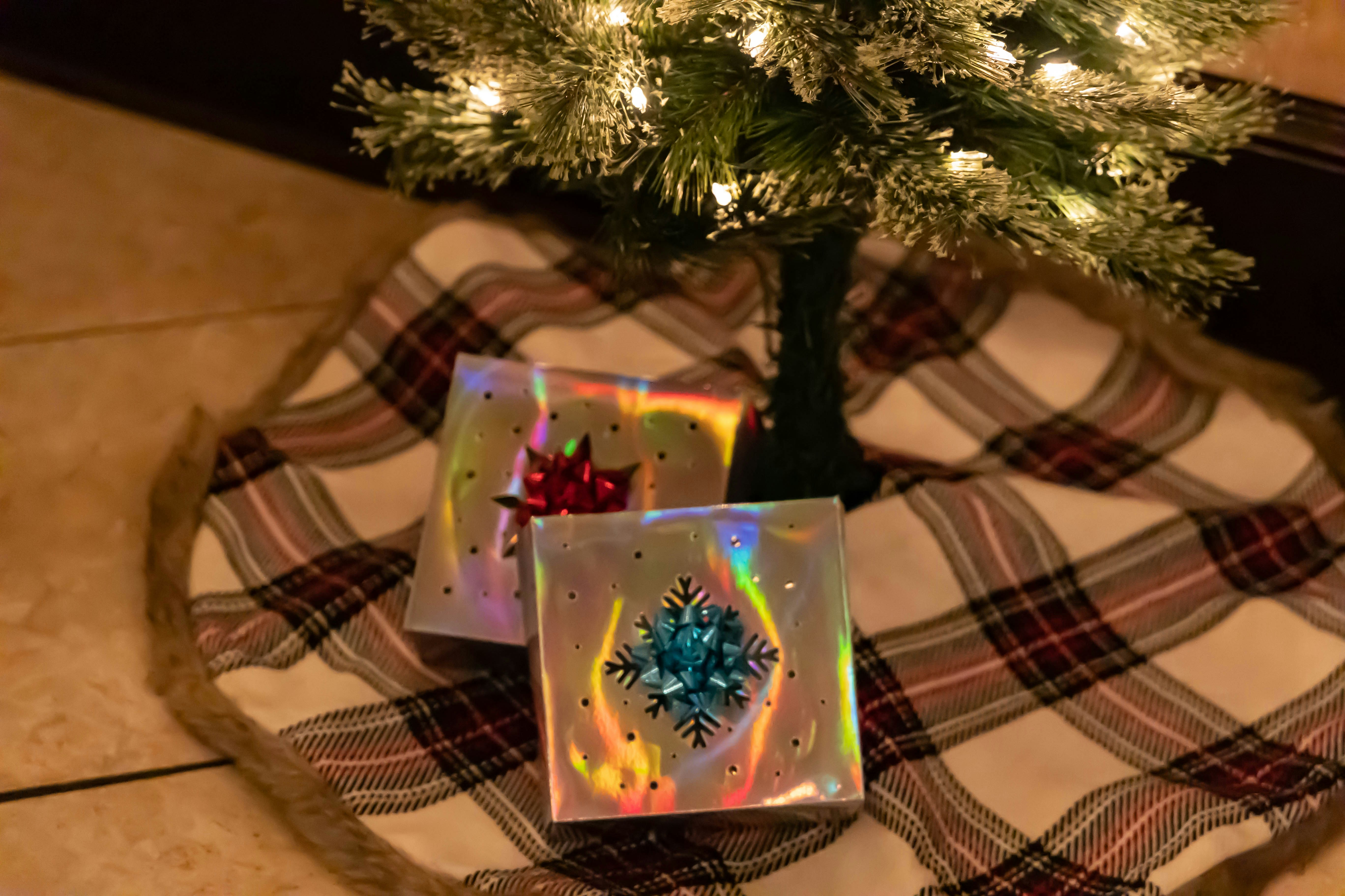 a tree with a gift wrapped gift wrapped gift wrapped around it