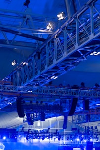 a large blue and white structure with people on it