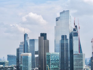 A city skyline with modern buildings representing real estate development.
