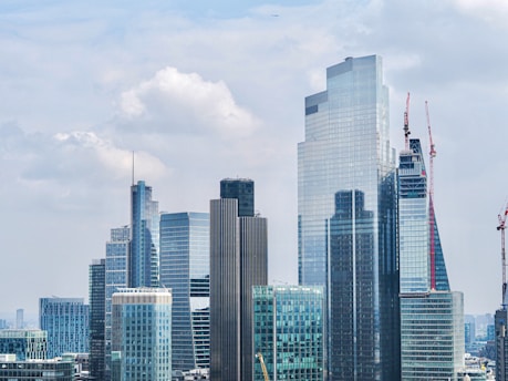 A city skyline with modern buildings representing real estate development.