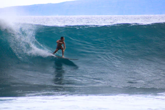 a man surfing on a wave