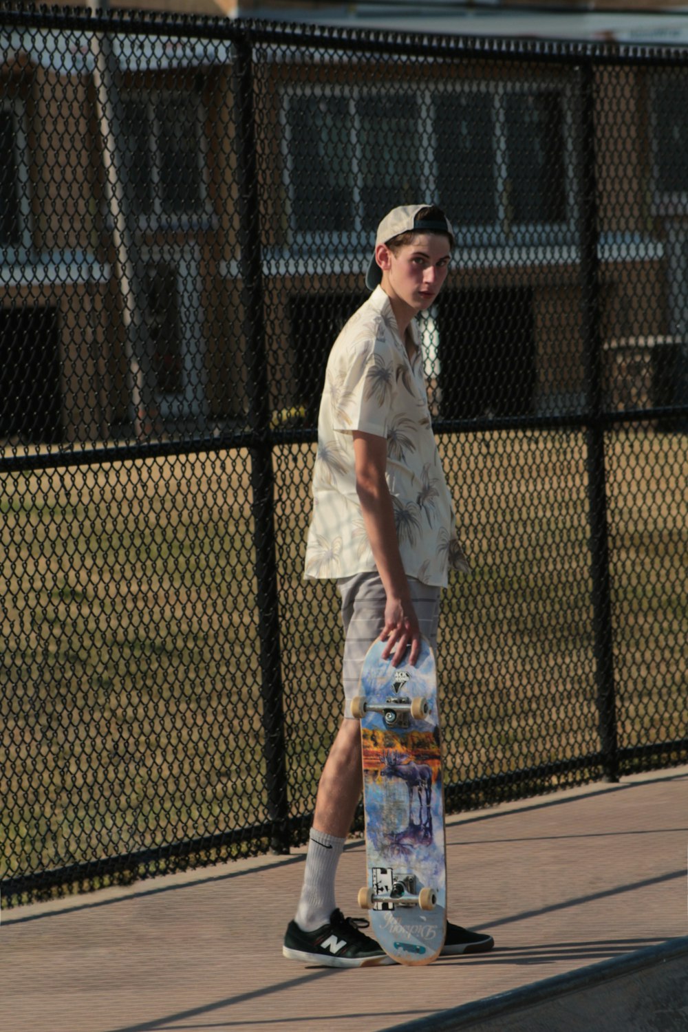 a man holding a skateboard