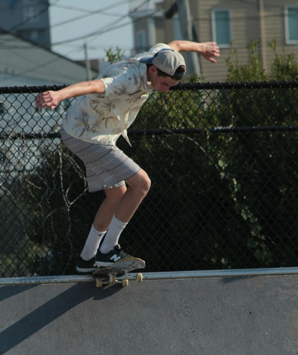 a boy skating on a ramp