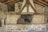 The original oak beams and inglenook fireplace inside the cottage.