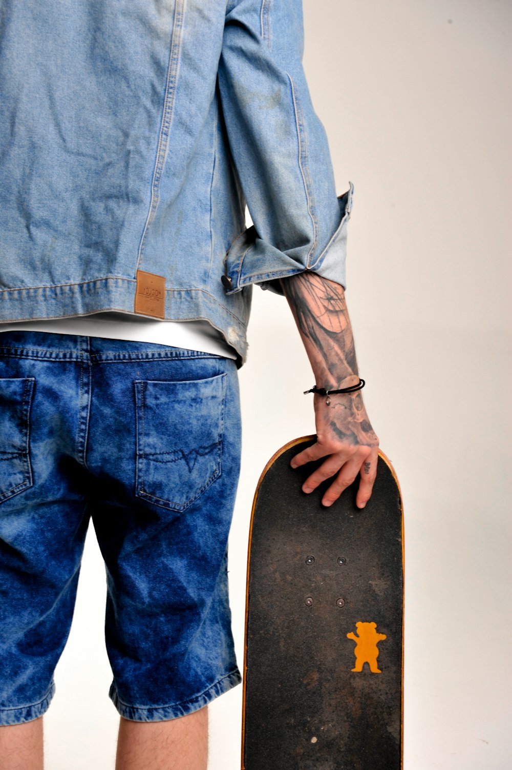 a man holding a skateboard