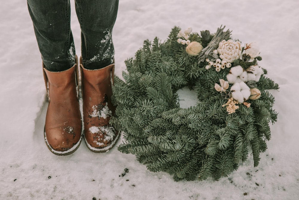 a person's feet and a bouquet of flowers