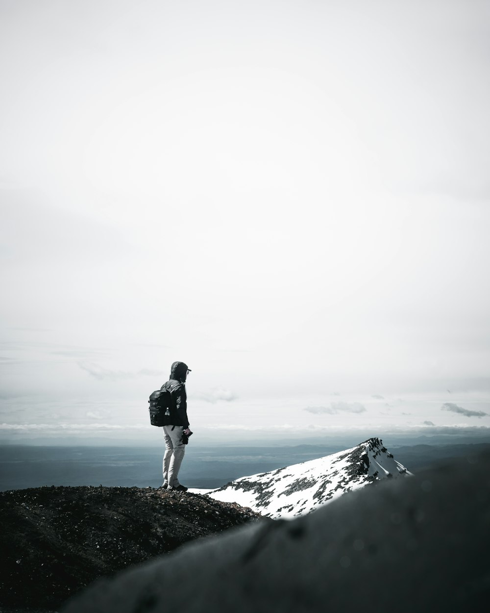 a person standing on a mountain