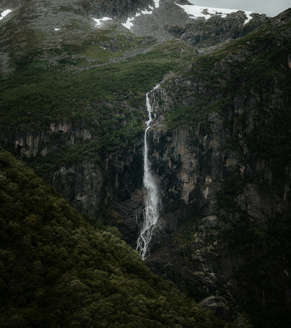 a waterfall in a mountain