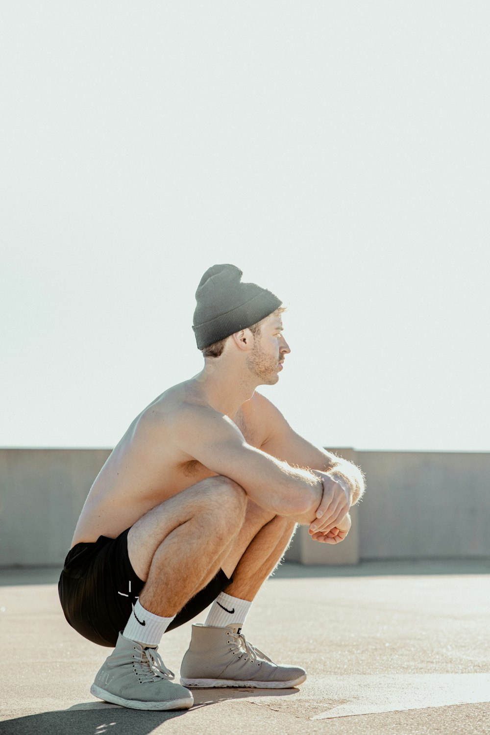 a man squatting down