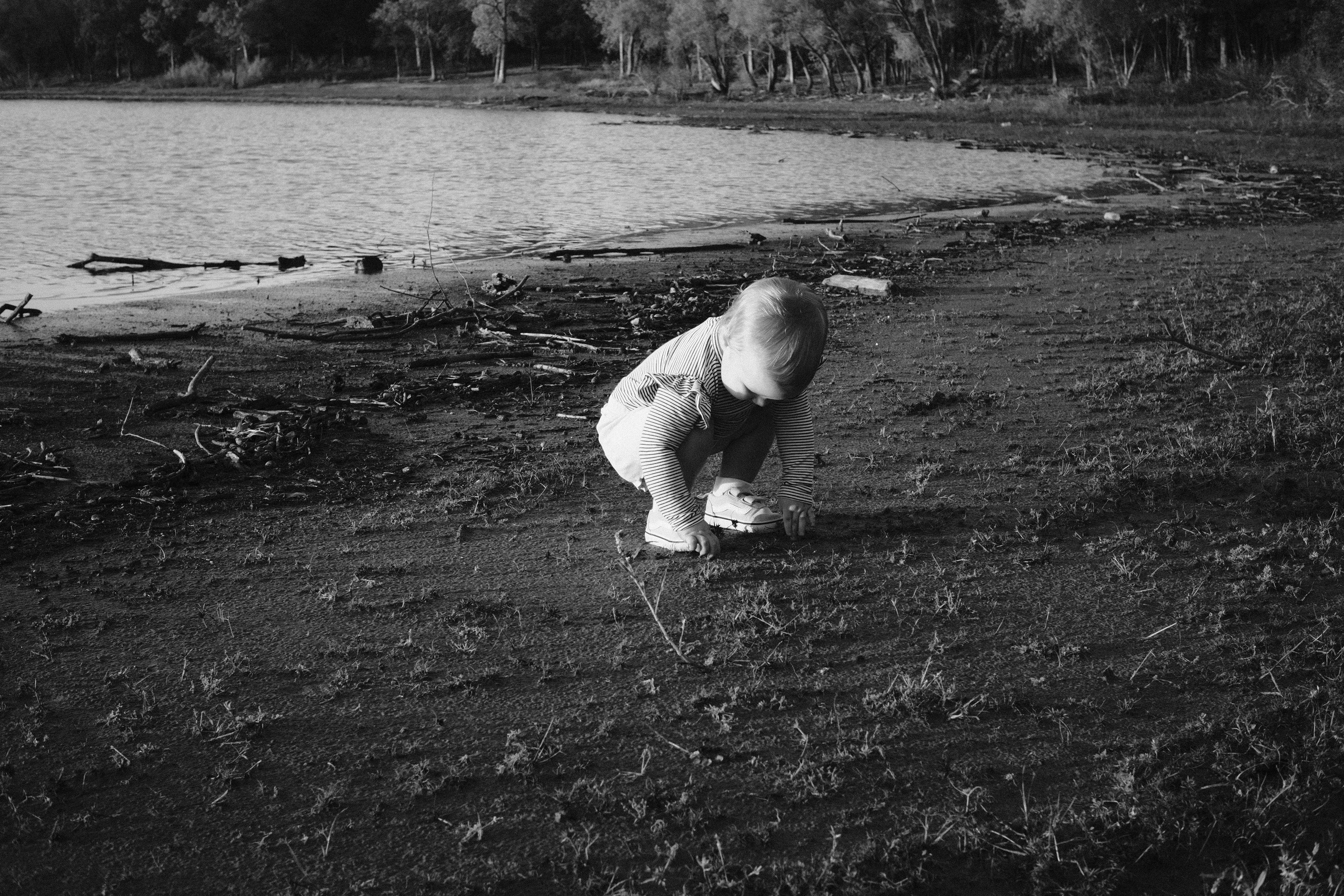 a child digging in the mud
