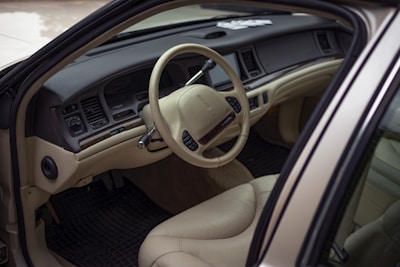 A detailed view of a car interior being cleaned.