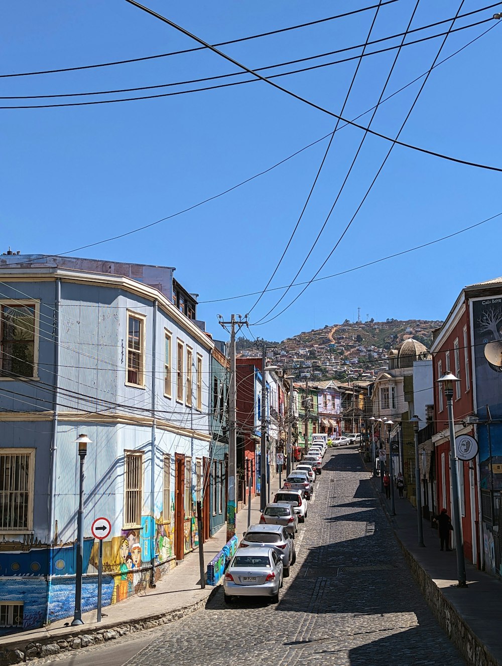 a street with cars parked on the side