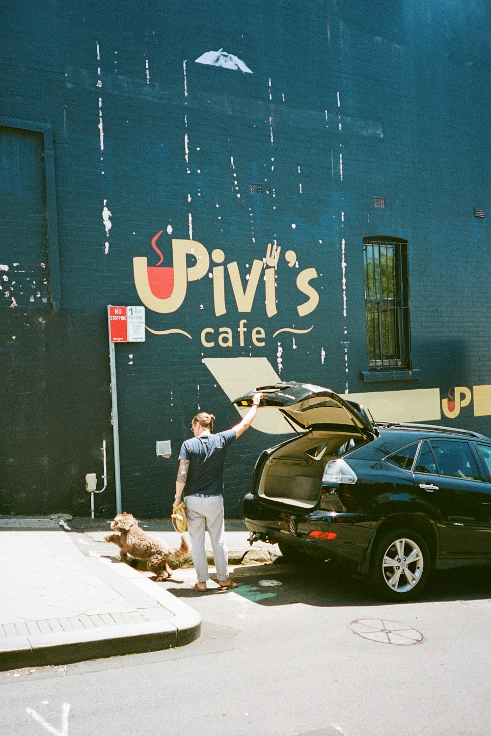 a person standing next to a car