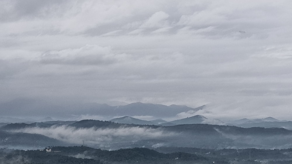 a landscape with mountains in the back