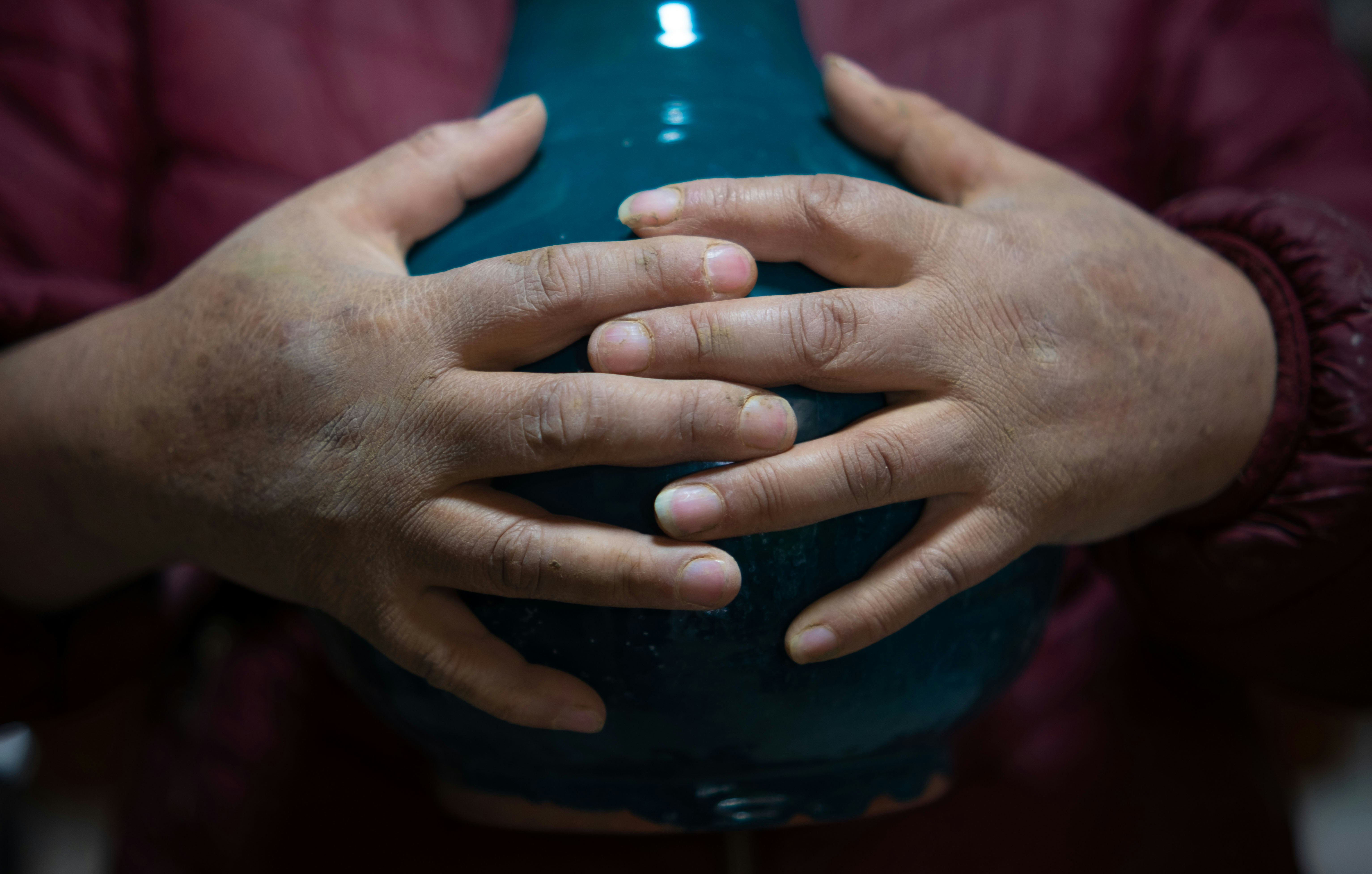 a close-up of hands shaking