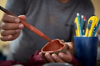 a person painting a heart