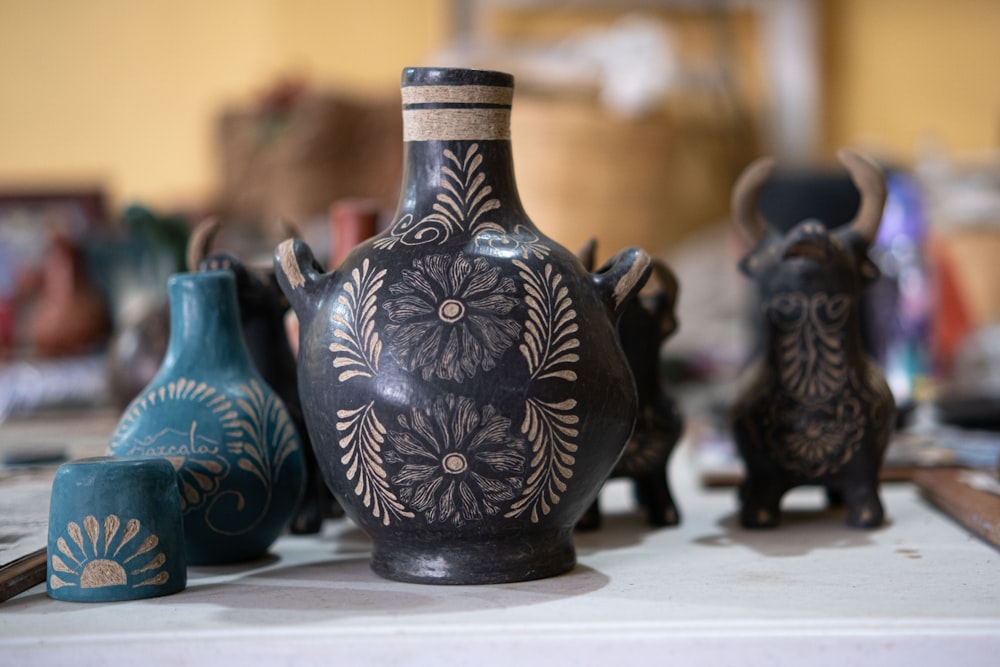 a group of vases sit on a table
