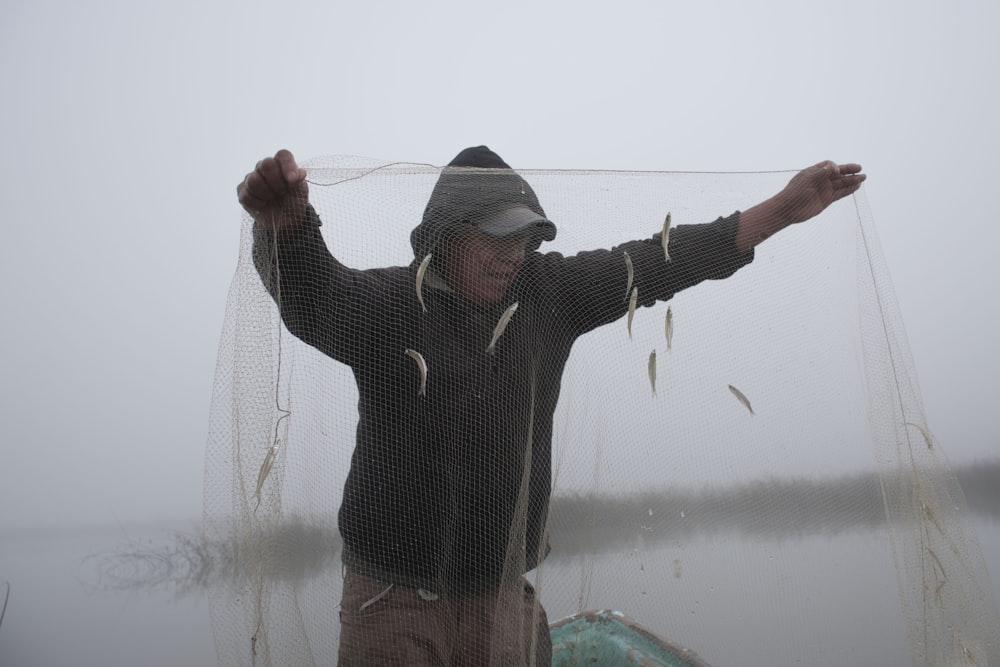 a man holding a fishing line