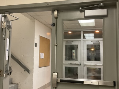 Hallway with secure access and notice board for tenants.