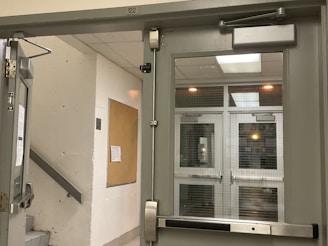 Hallway with secure access and notice board for tenants.