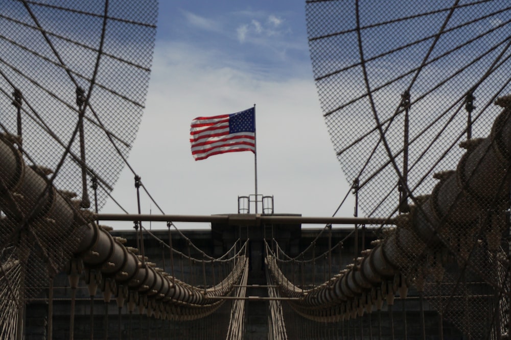 a flag on a bridge