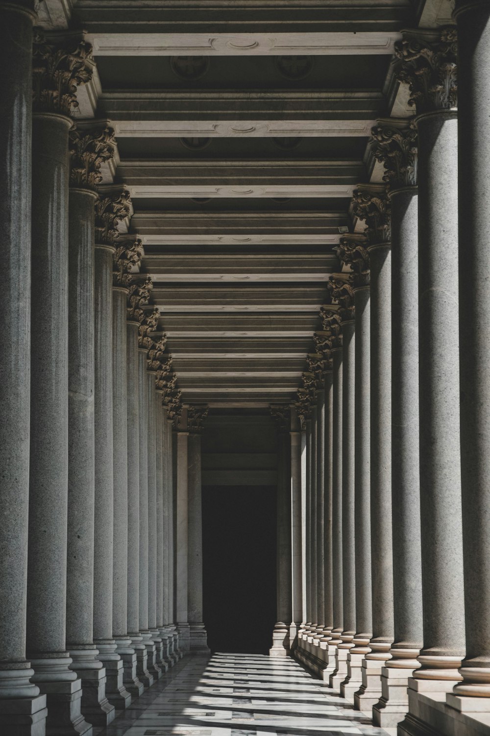 a hallway with pillars