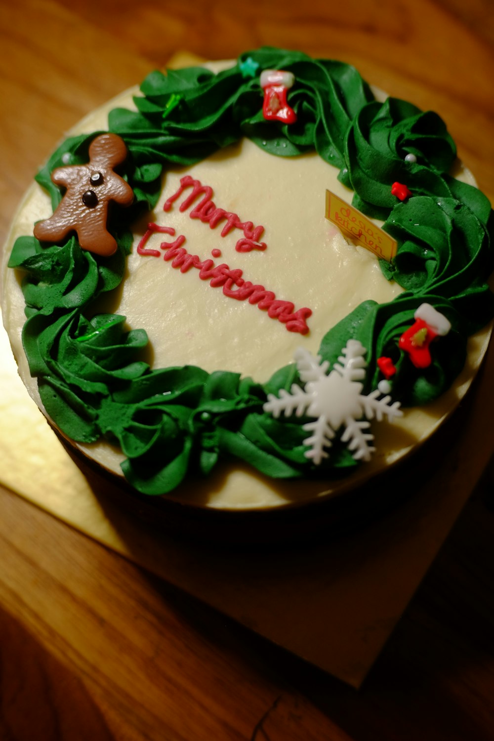 a cake with a green frosting and a green ribbon