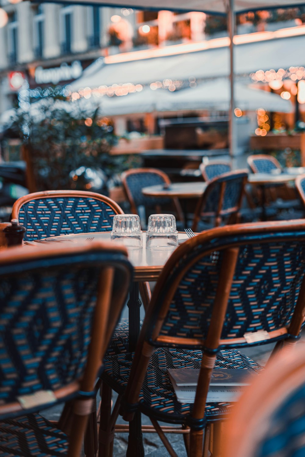 a group of tables and chairs outside