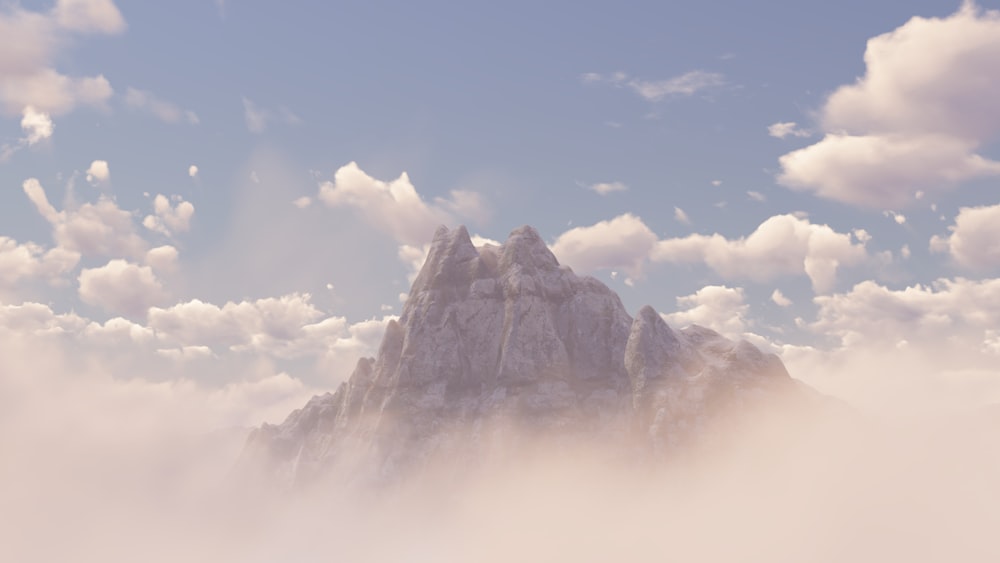 a mountain with clouds below