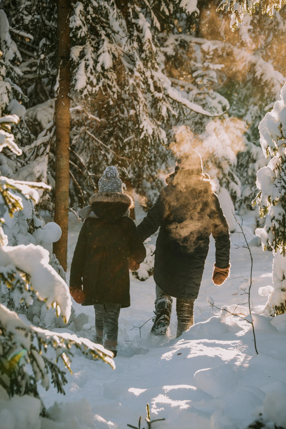 two people walking in the snow
