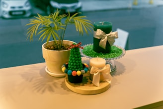 Assorted return gifts including candles and small plants for corporate events