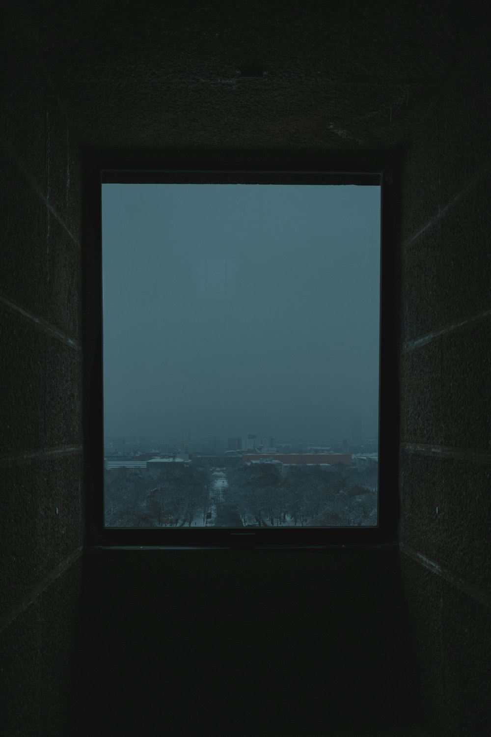 a window with a view of a city