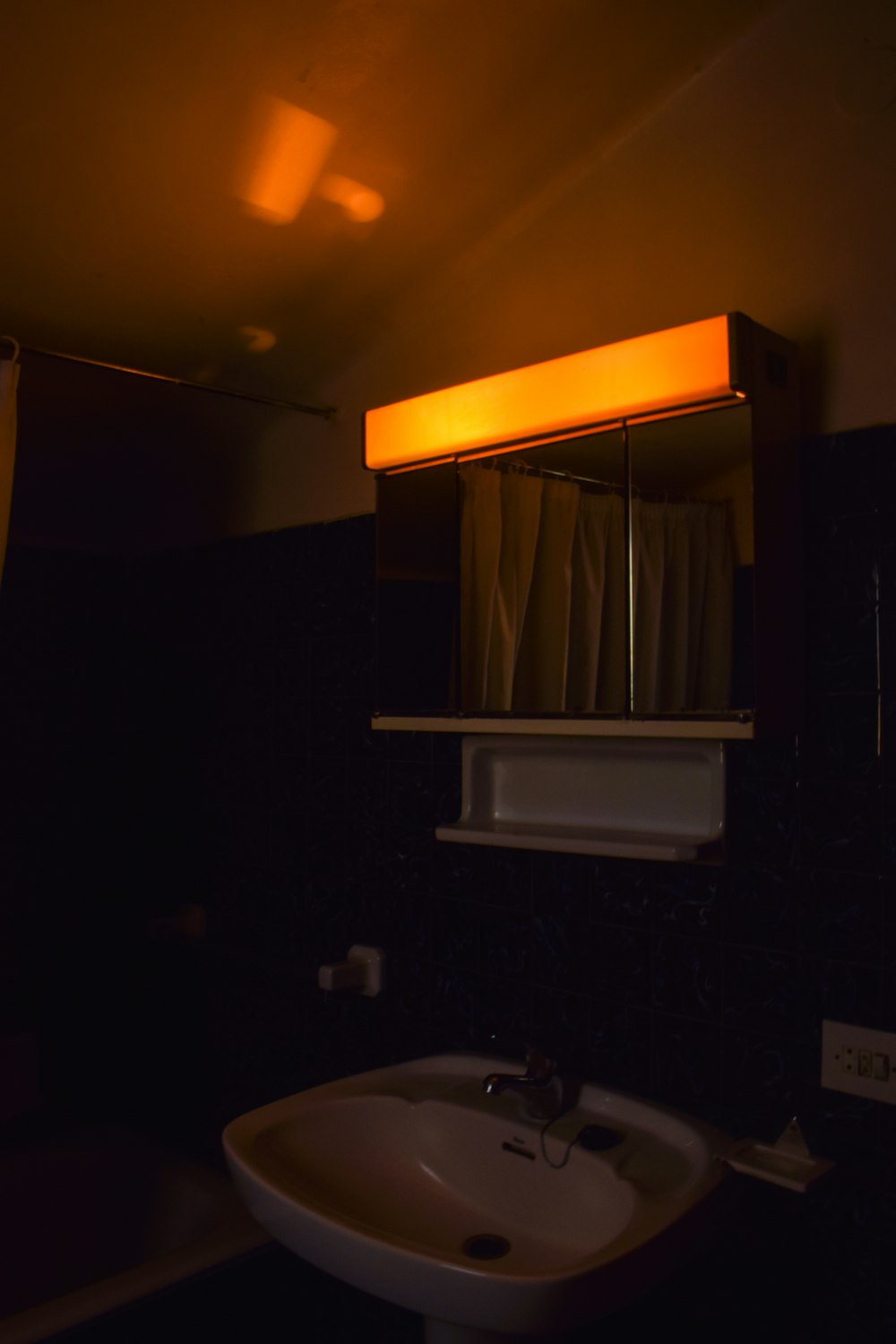 a bathroom with a mirror and a sink