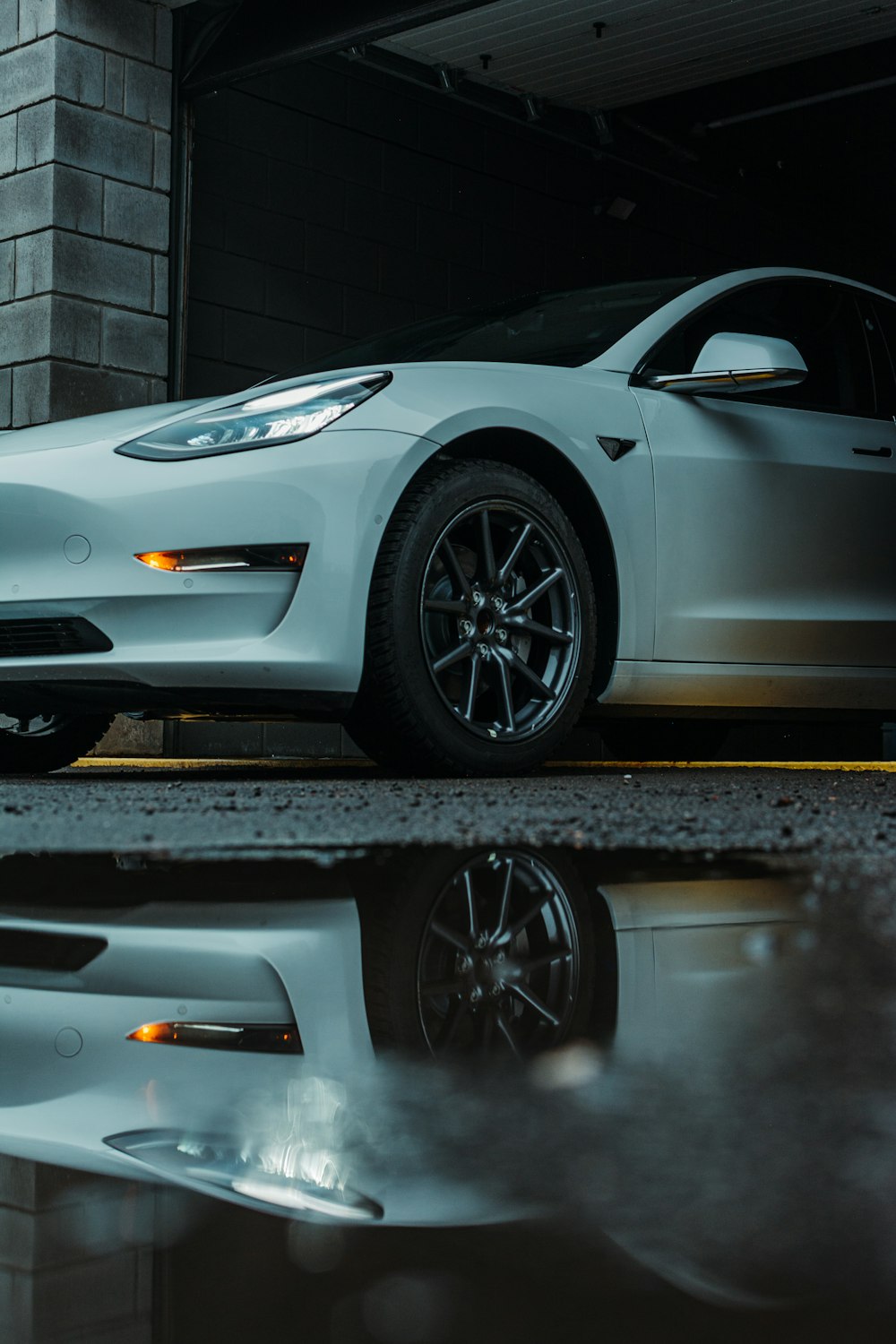 a white car parked in a garage