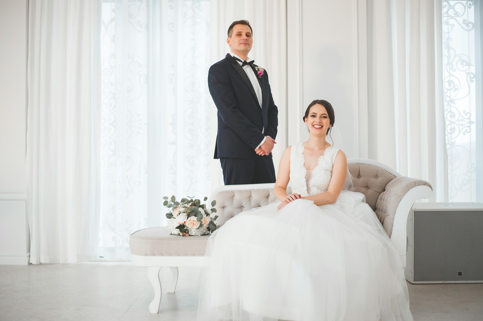 a man and woman in formal wear