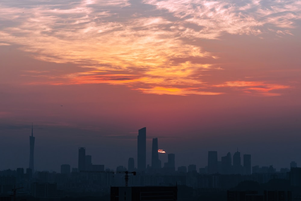 a city skyline at sunset