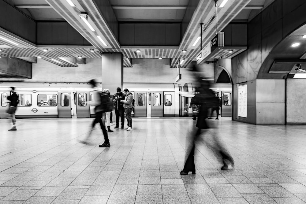 people walking in a train station