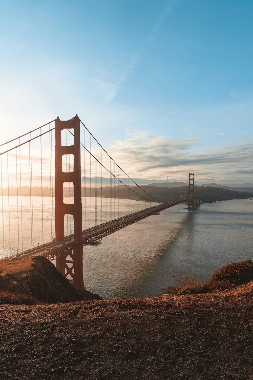 a large red bridge over water