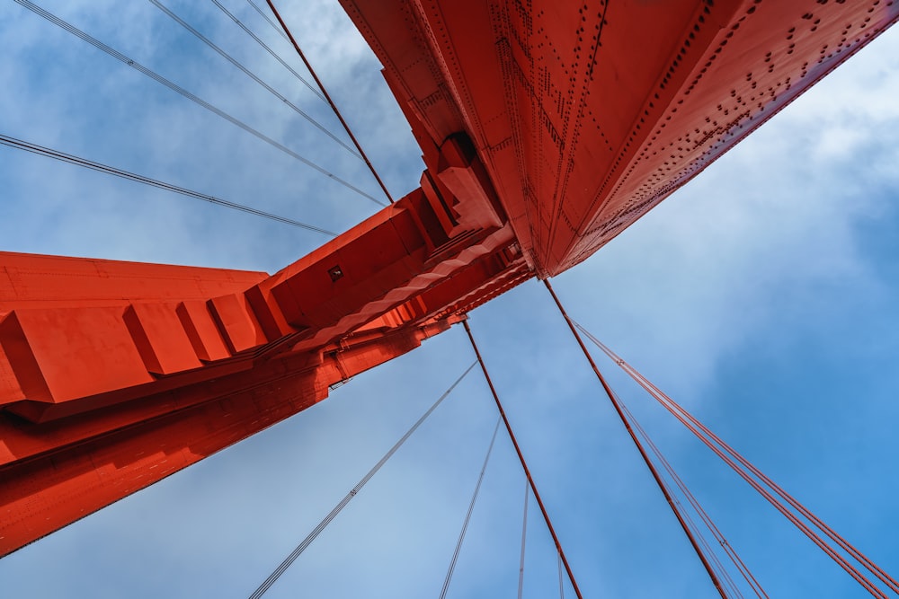 a red bridge with cables