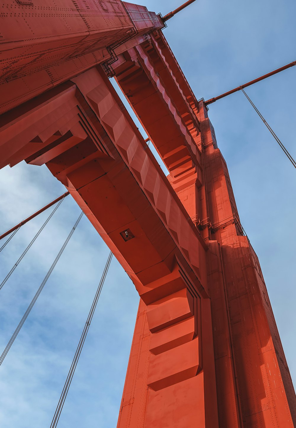 a red bridge with cables